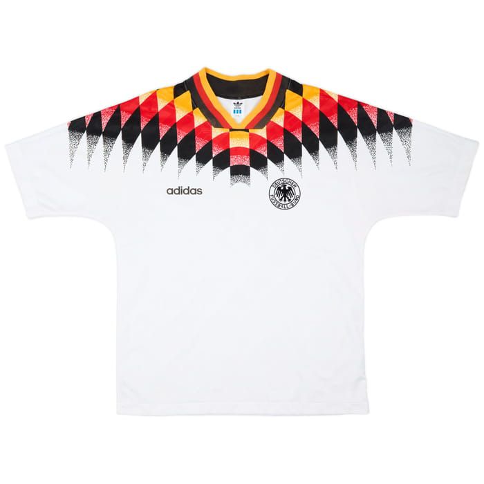 007c0a7c-8c7e-455b-8e69-843e153a6841 | AE JERSEY White Adidas Germany soccer jersey featuring a black‑red‑yellow diamond pattern across the shoulders and the federation crest on the chest left side.