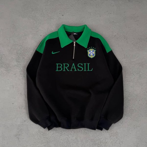 Black pullover sweatshirt with green collar and shoulders, BRASIL text across the chest and a Brazil crest on the left, plus a small Nike swoosh.