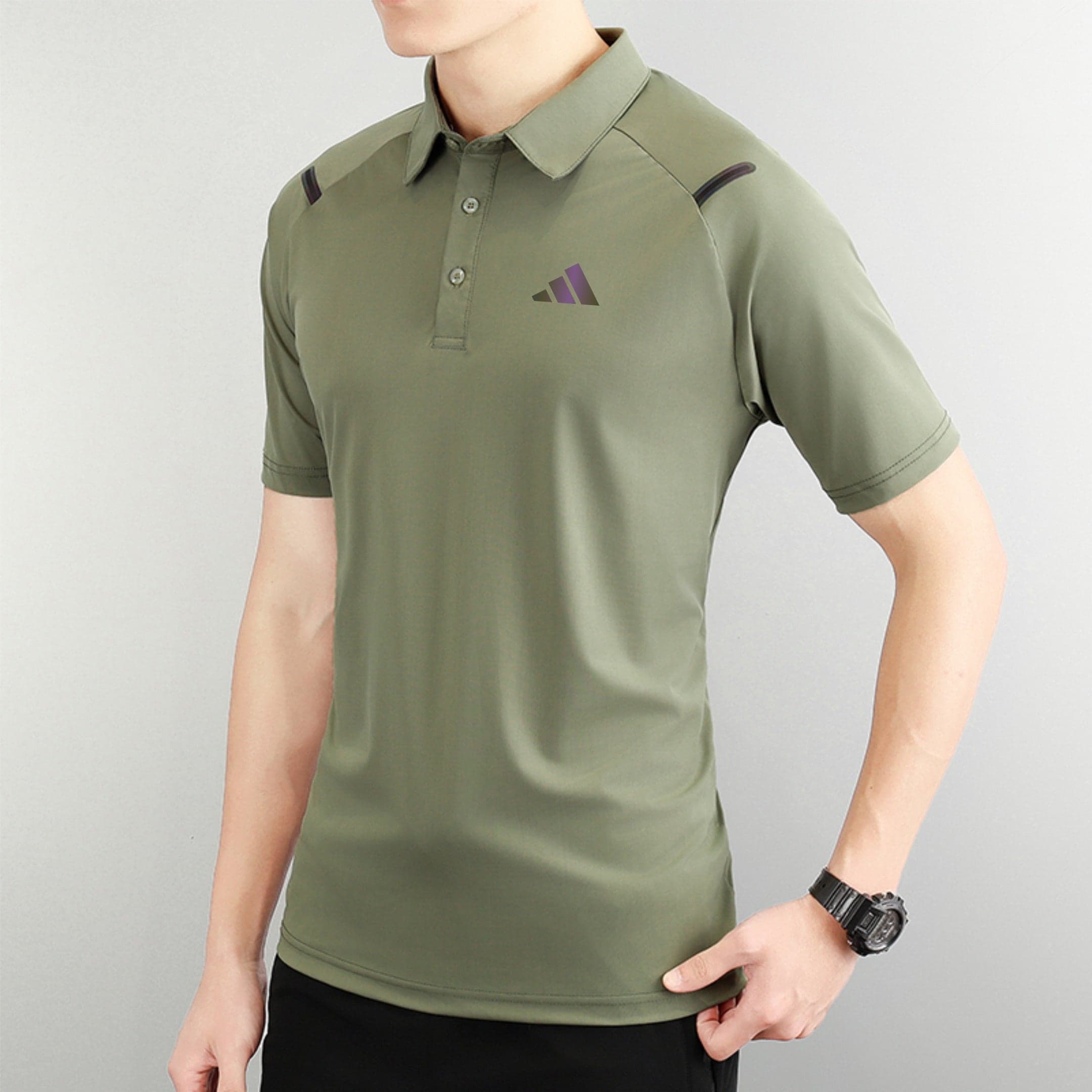 1101b6f3 | AE JERSEY Person wearing an olive polo shirt with a small purple logo on the left chest, against a light background.