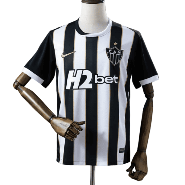 Black and white striped football jersey on a mannequin, CAM club crest on chest, H2bet sponsor across the front.