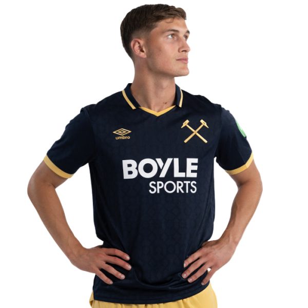 Male model wearing a navy football shirt with gold trim and a crossed-hammers crest, featuring the Boyle Sports sponsor logo.