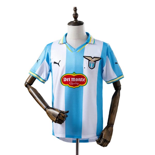 Lazio soccer jersey on a mannequin with blue and white vertical stripes, Del Monte sponsor badge and club crest.