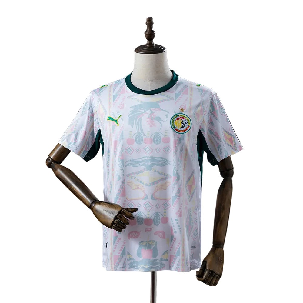 168a96a1 | AE JERSEY White Senegal national football team jersey on a mannequin, with a green collar and lion crest.