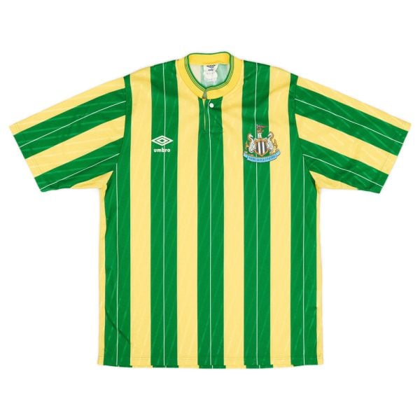 Green and yellow vertically striped soccer jersey with Umbro logo and Newcastle United crest on the chest