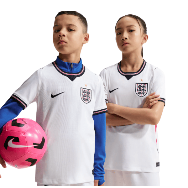 1_100dfa4e-4b85-46cd-95d6-06556e0281bb | AE JERSEY Two young soccer players in England white jerseys with navy trim stand against a white background; the left player holds a pink soccer ball.