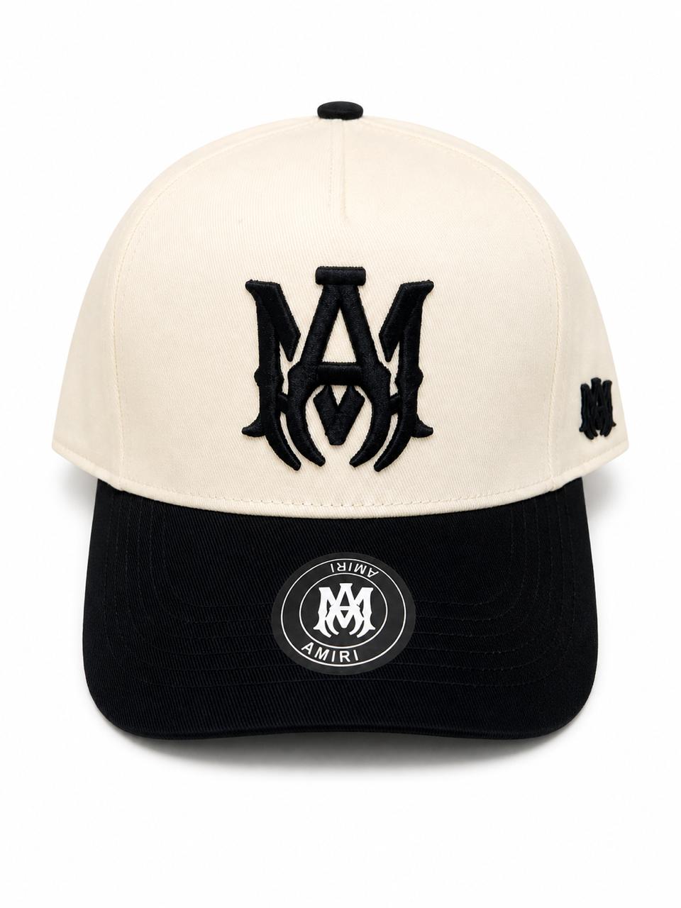 22c1d2cd-85f6-47d6-a319-7eb3784c6d15 | AE JERSEY Beige crown and black brim baseball cap with a large black embroidered monogram on the front and a small side logo.