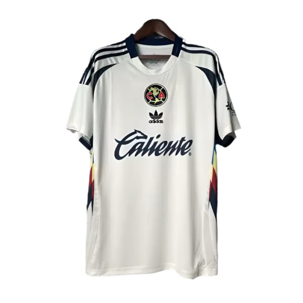 White Adidas football jersey with Club América crest and Caliente sponsor on the chest, hanging on a wooden hanger.