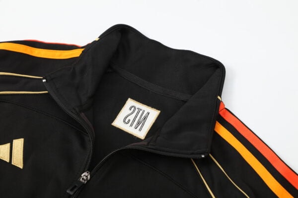 28a6e889-600x400-1 | AE JERSEY Black zip-up jacket with orange and yellow stripes along the sleeves and a small emblem on the chest near the zipper.