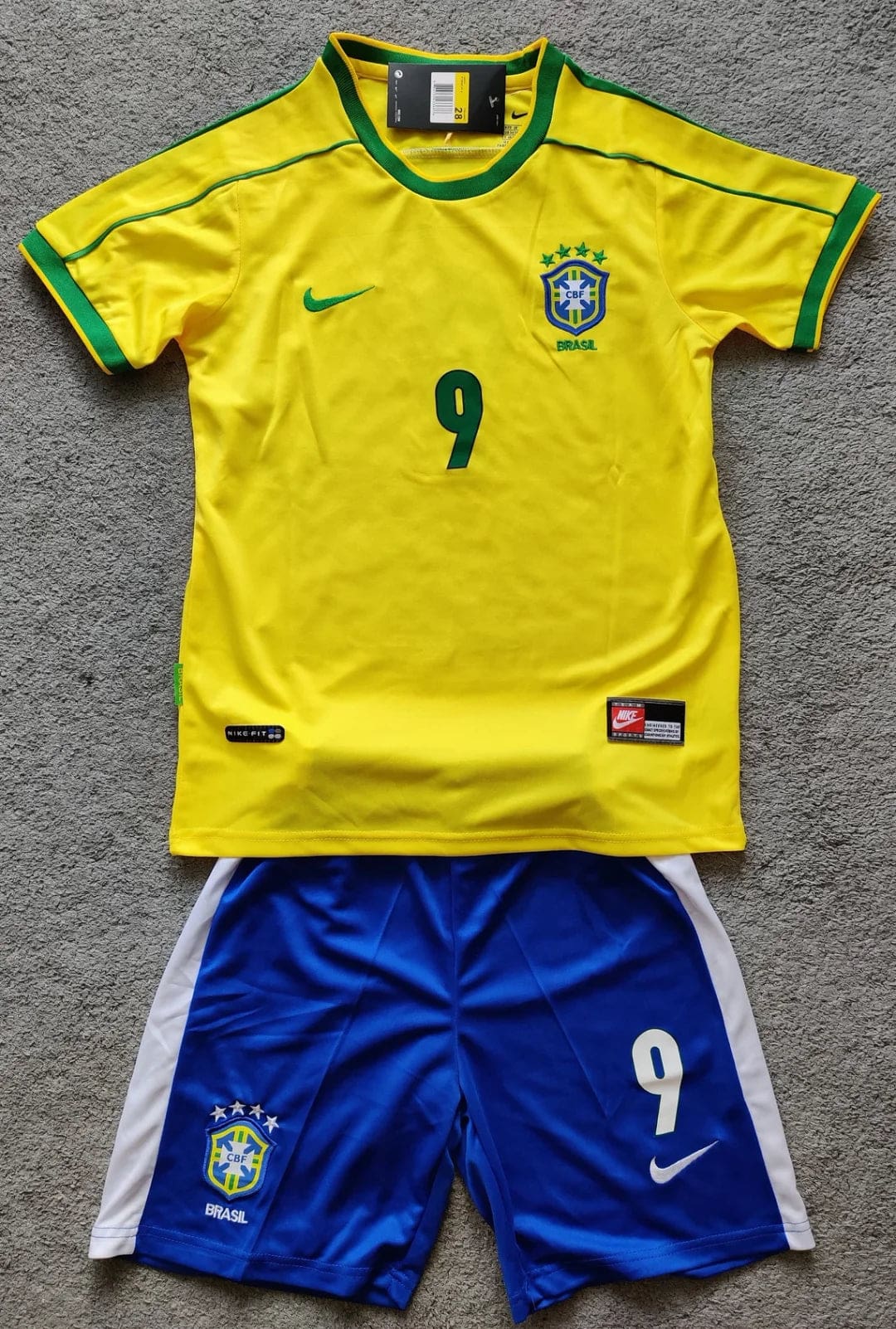 35db52fcc5e129deb68247d7879f3465 | AE JERSEY Brazil national football team kit: yellow jersey with green trim and number 9, blue shorts with Brazil crest and white side panels.