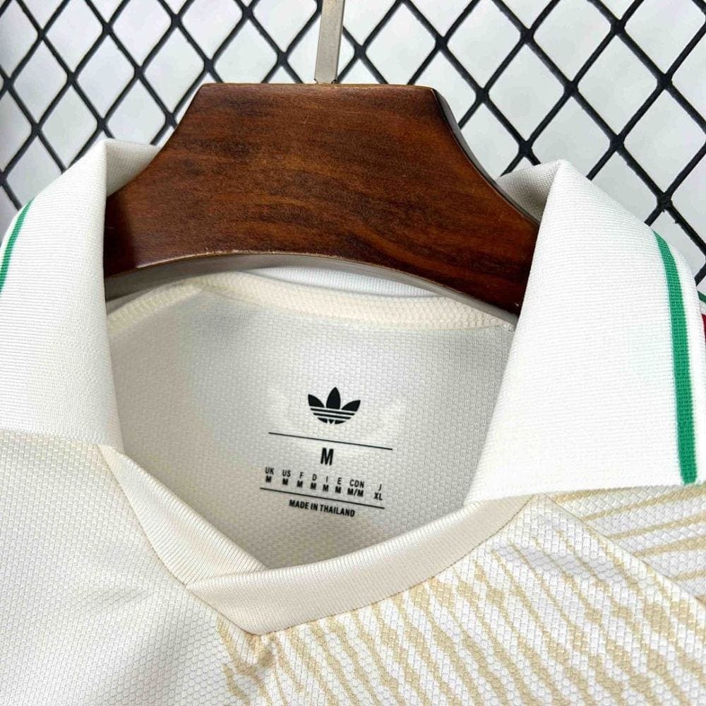 4A337B15-E565-4828-81D8-DF915A945C41 | AE JERSEY White polo shirt on a wooden hanger; Adidas logo on the inner label shows size M and 'Made in Thailand'.