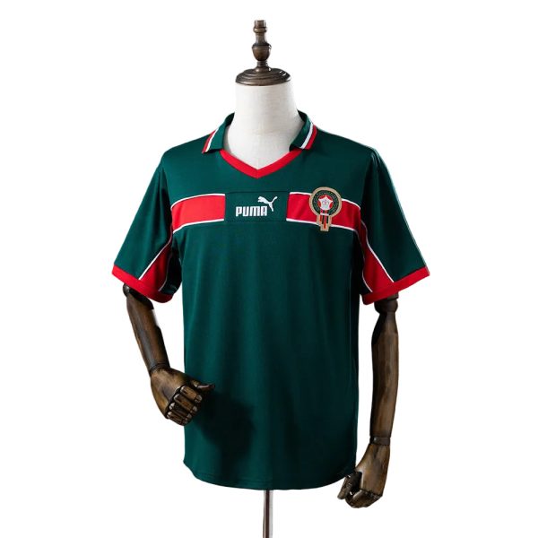 4d04d7d0 | AE JERSEY Green soccer jersey on a mannequin with red and white chest stripes, Puma logo, and club crest on the left chest.