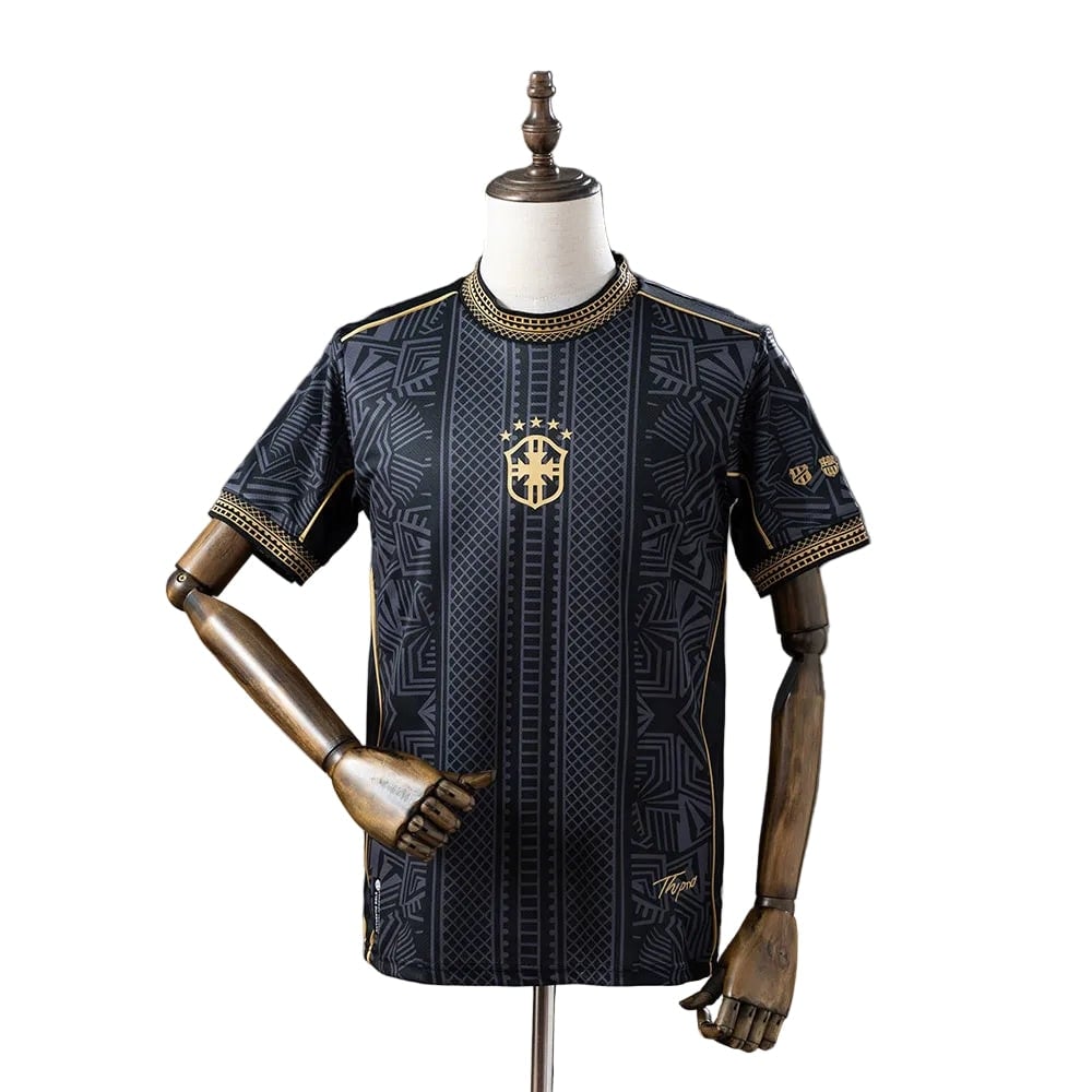 4e88d07c | AE JERSEY Black and gold patterned soccer jersey on a dress form, featuring crest and stars.