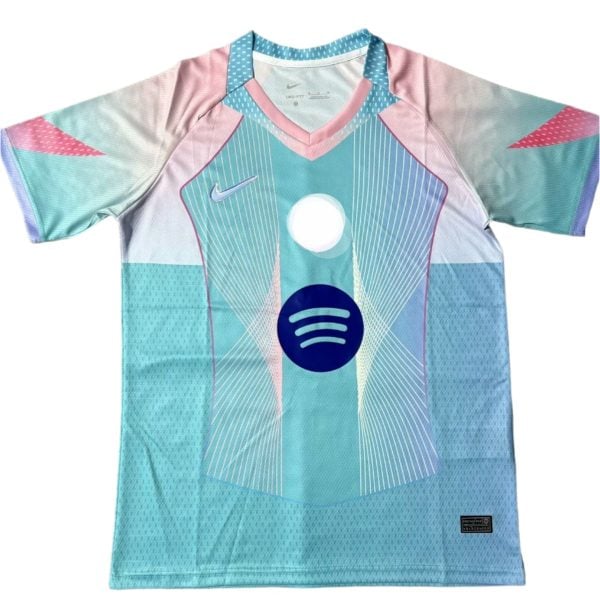 Colorful athletic jersey with light blue, pink, and teal gradients, white geometric lines, and a blue Spotify logo on the front center; V-neck collar visible.