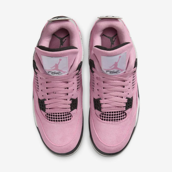 502387fe_7ff4_4fd7_89a2_109007b5ee6e | AE JERSEY Top-down view of pink sneakers with black accents and white midsole, showing Jumpman logo on tongues (pair of shoes).