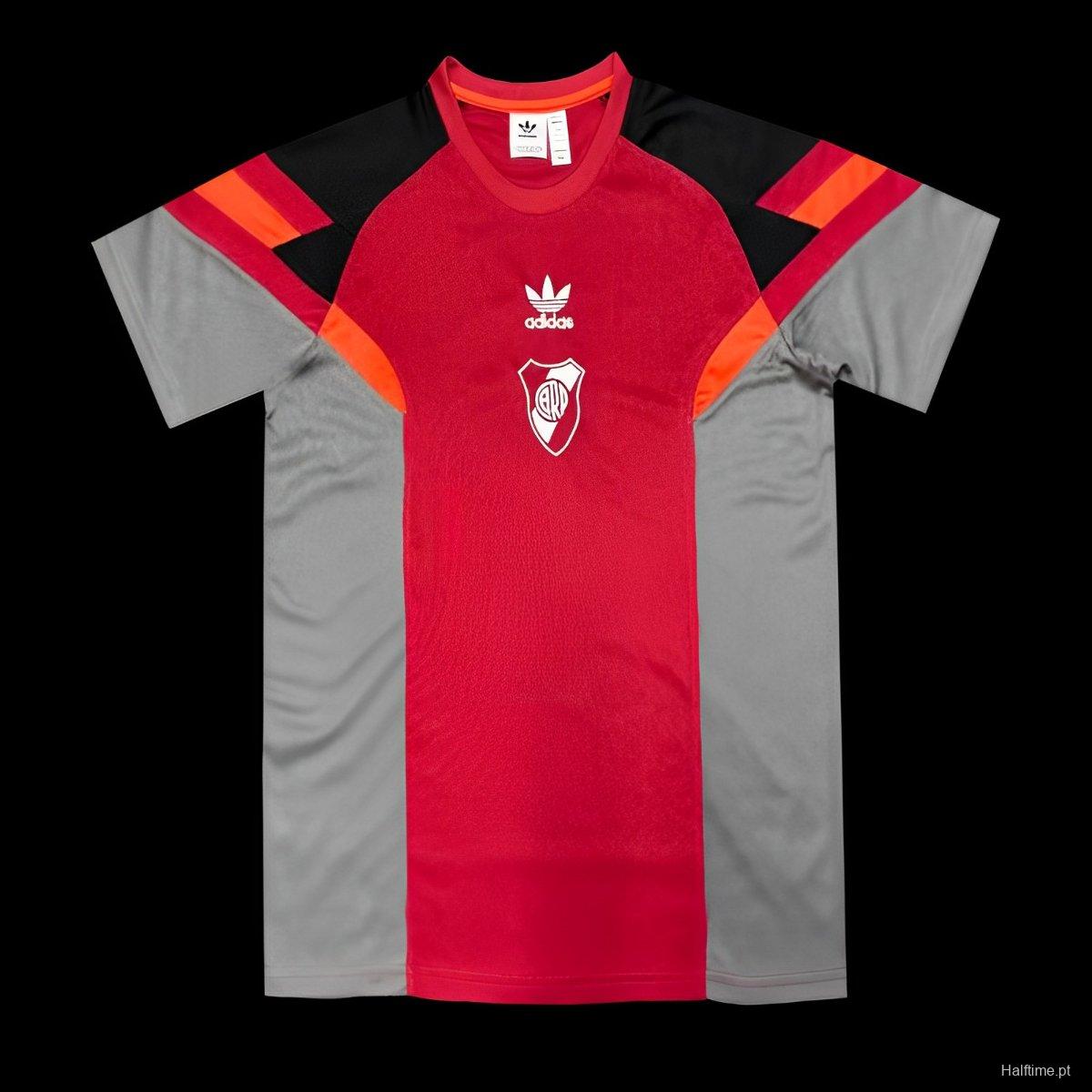 5c10faeb7ad54e3831c7c2e1 | AE JERSEY Red and gray Adidas soccer jersey with a red central panel, gray sides, and black/orange shoulder accents, featuring a white club crest on the chest.