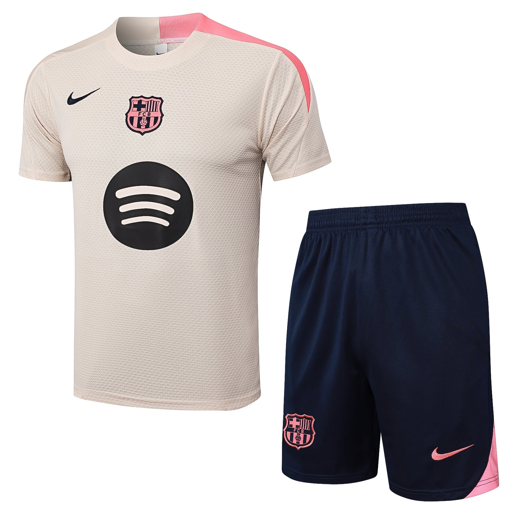 5d484f63_1 | AE JERSEY Beige FC Barcelona soccer jersey with pink accents, crest and a large black circular logo on the front, paired with navy shorts.