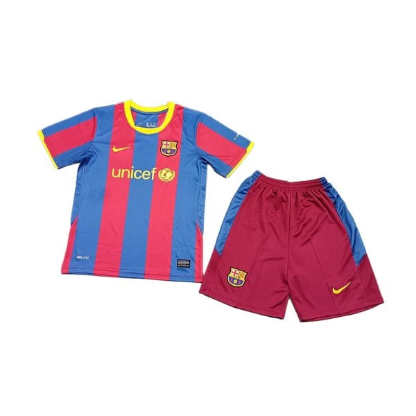 Barcelona football kit: blue and red striped jersey with UNICEF logo and club crest, paired with maroon shorts with blue side panels and a yellow Nike swoosh.