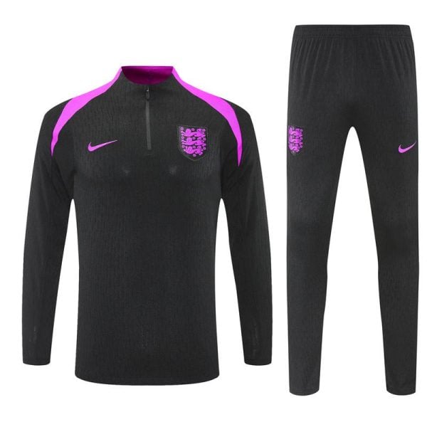 England national football team training set: black long-sleeve top with pink shoulder panels, crest on left chest and pink Nike swoosh; matching black pants with crest and swoosh.