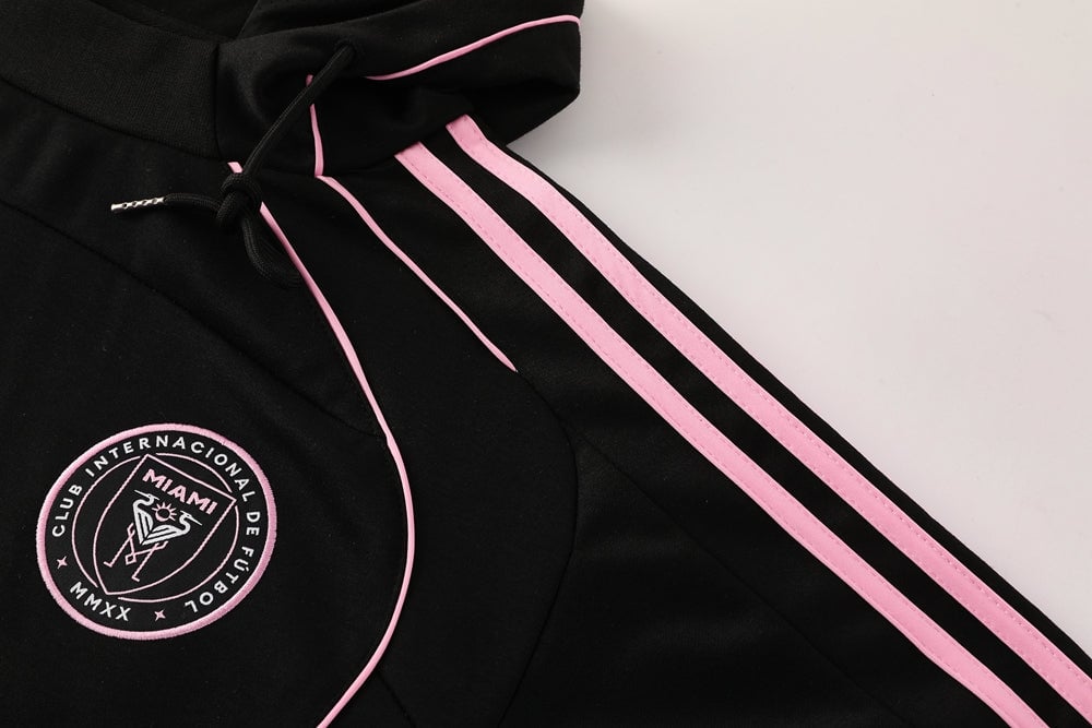 71f3ef37 | AE JERSEY Black hoodie with pink side stripes and a circular Miami club emblem on the chest area.