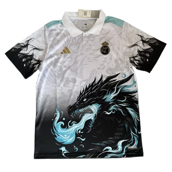 Real Madrid polo jersey with a bold black dragon graphic across the front and teal accents on the shoulders and collar.
