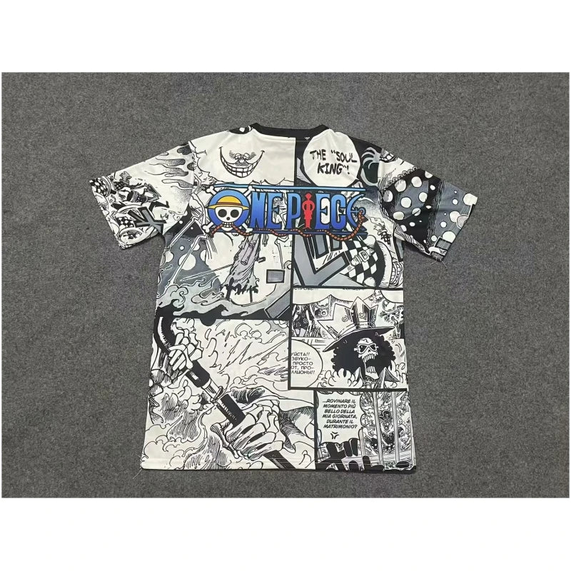 770a5abb440fd95b-1-800x800-1 | AE JERSEY White manga-collage T-shirt featuring One Piece branding and comic panels, laid flat on a gray carpet.