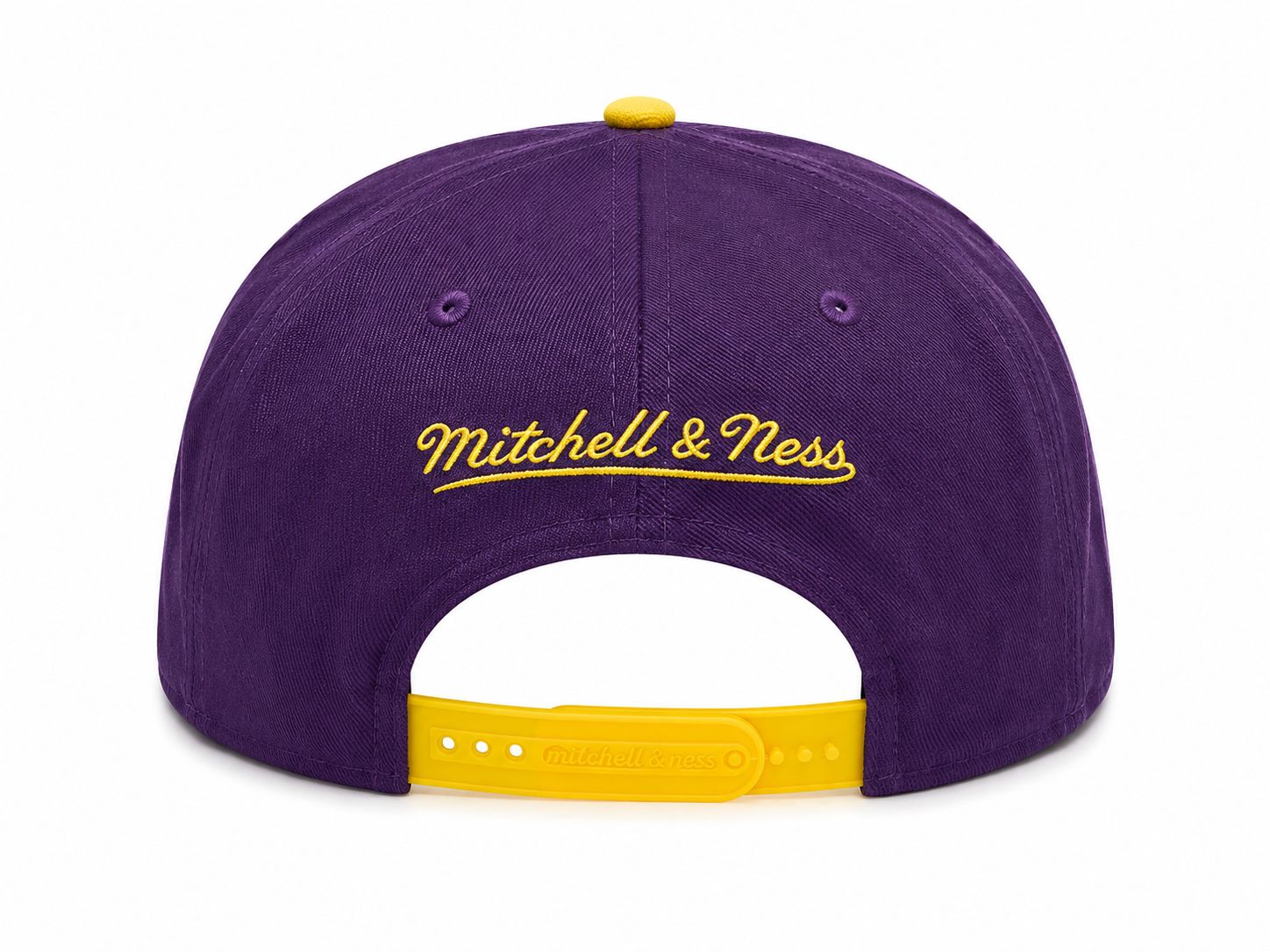 77b93d58-8bf8-4fd9-9b0d-a0074fbfae9d | AE JERSEY Purple Mitchell & Ness cap viewed from the back with a yellow adjustable strap and embroidered yellow script logo across the crown.