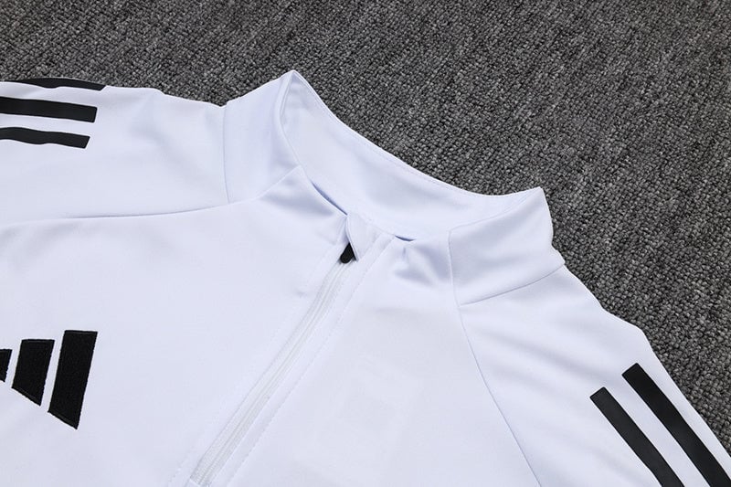 79441927 | AE JERSEY White zip-front athletic jacket with black three-stripe sleeves on a gray carpeted surface.