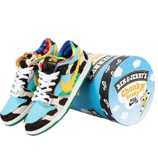 Pair of colorful kids' sneakers with cow-print panels next to a Ben & Jerry's Chunky Dunky ice cream tub.