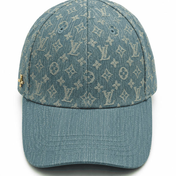 Denim baseball cap with a beige Louis Vuitton monogram pattern and a curved brim.
