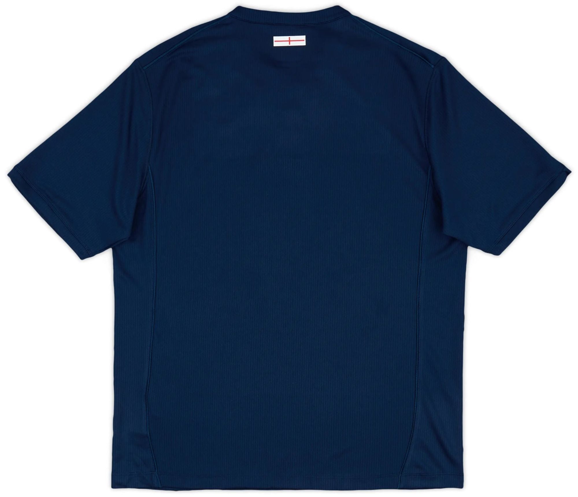 8056072326724-2_ug2fgjm8srohrgi4 | AE JERSEY Back view of a navy blue polo shirt with a small white label featuring a red line near the collar area