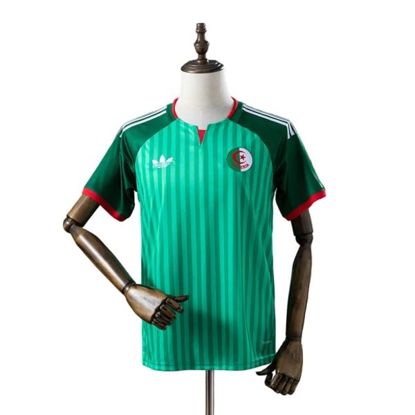Front view of a green Algeria national team soccer jersey on a mannequin, featuring vertical stripes and crest.