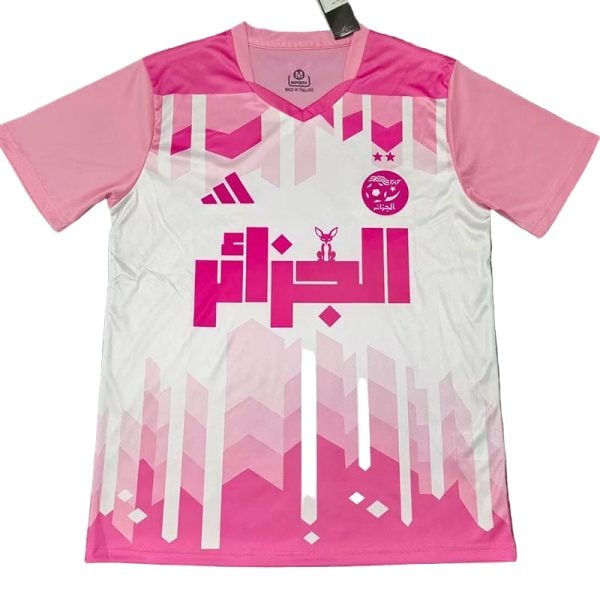 Pink and white soccer jersey with geometric pink pattern and Arabic text logo on the chest.