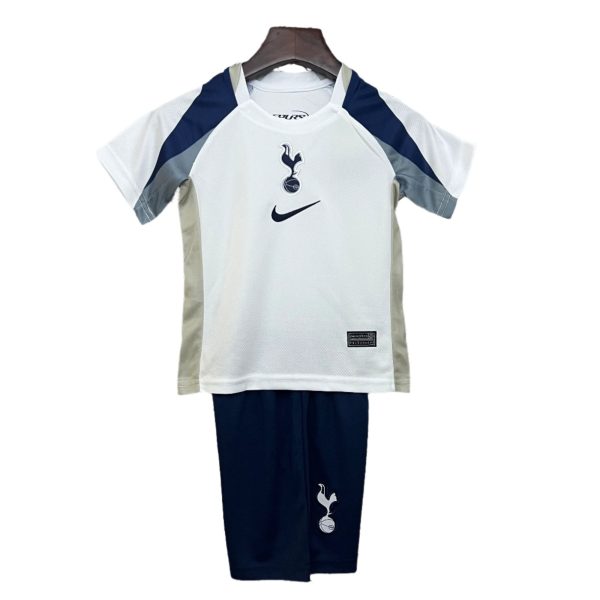 White Tottenham Hotspur football jersey on a hanger, featuring navy panels, Nike swoosh and club crest on the chest.