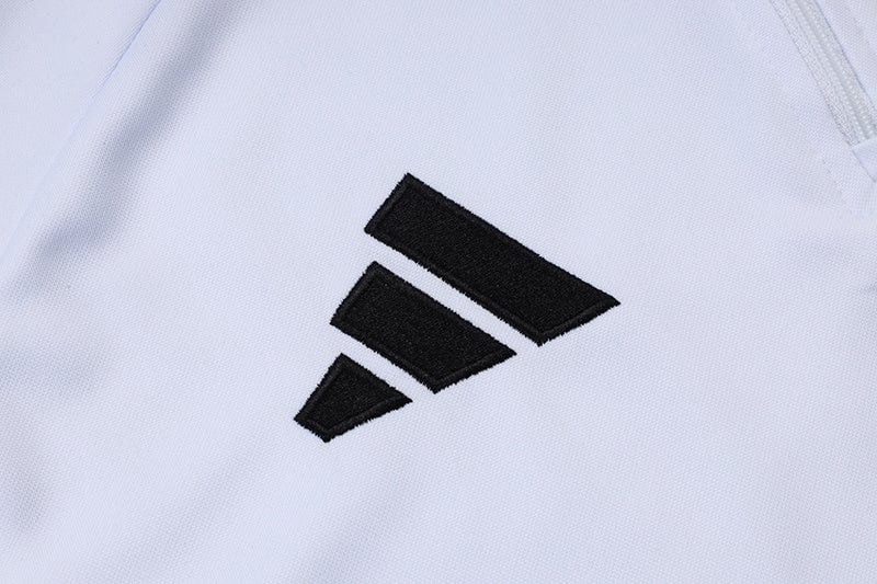 913d0725 | AE JERSEY Close-up of a black Adidas three-stripe logo on white fabric (sports jersey).