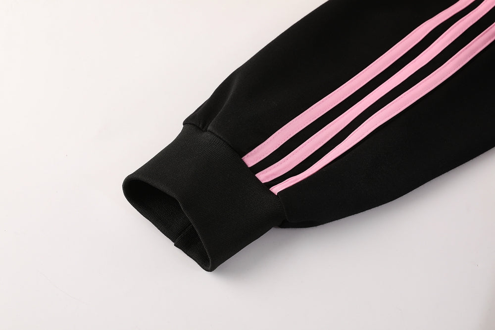 914f4ac3 | AE JERSEY Black athletic pant sleeve cuff with pink triple stripes and ribbed edge.