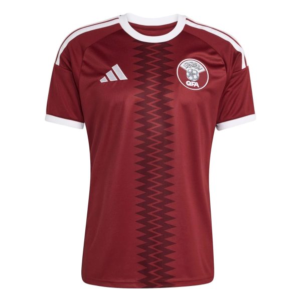 Maroon Adidas sports jersey with white trim, a zigzag central pattern, and the QFA crest on the left chest.