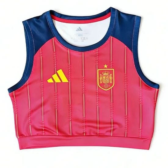 Pink sleeveless training cropped top with blue shoulders, featuring the Spain crest on the chest and a yellow Adidas logo.