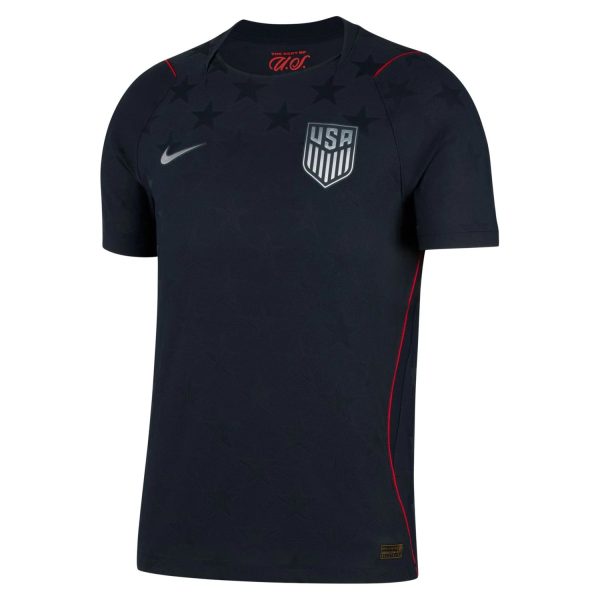 Navy USA soccer jersey with a subtle star pattern, white Nike swoosh on the right chest, and USA crest on the left chest.