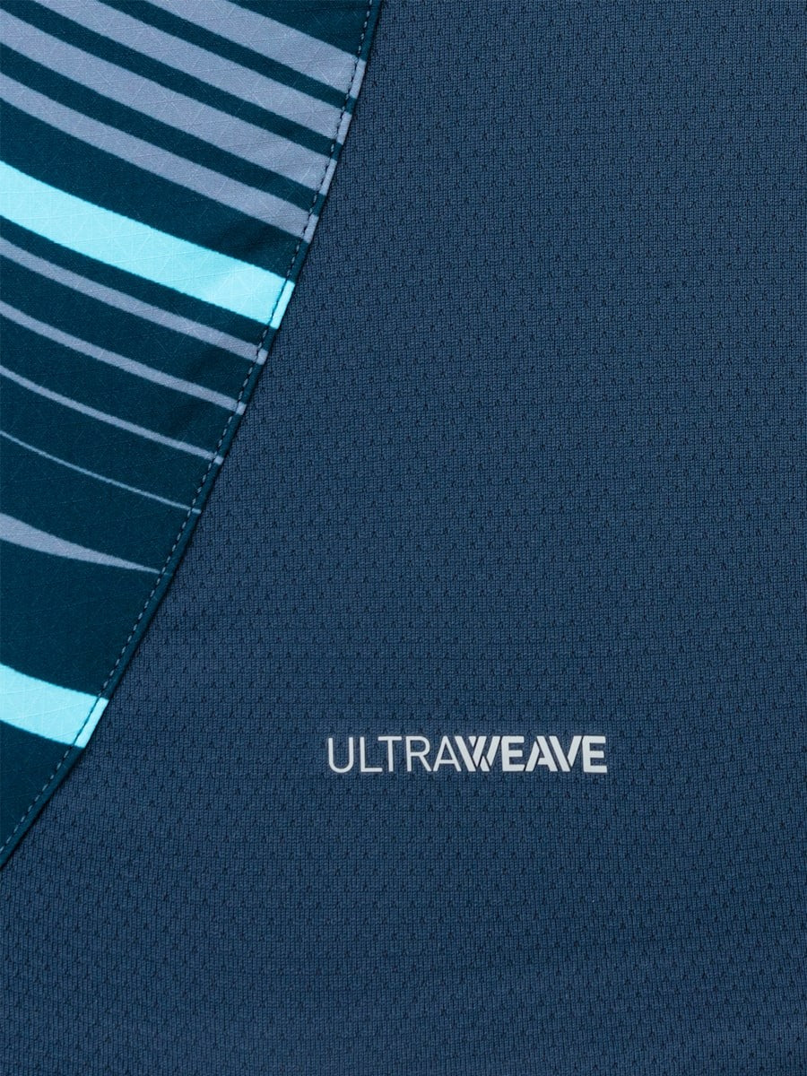 AtMVNLIKAuuxgTM | AE JERSEY Close-up of dark blue UltraWeave fabric with a diagonal teal-striped panel on the left.
