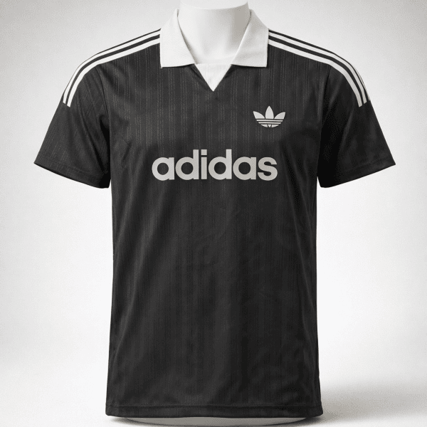 Black Adidas polo jersey with cream collar and cream stripes on shoulders, front logo and large 'adidas' text