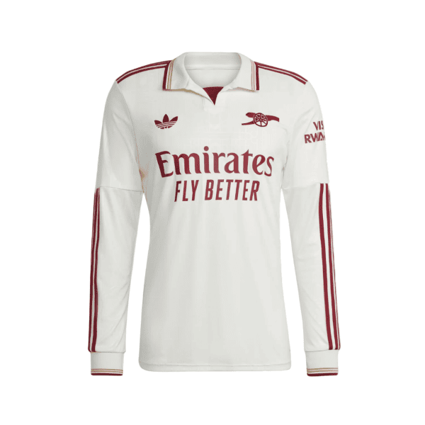 White long-sleeve football jersey with Emirates Fly Better sponsor text and red team logos on chest and sleeves.