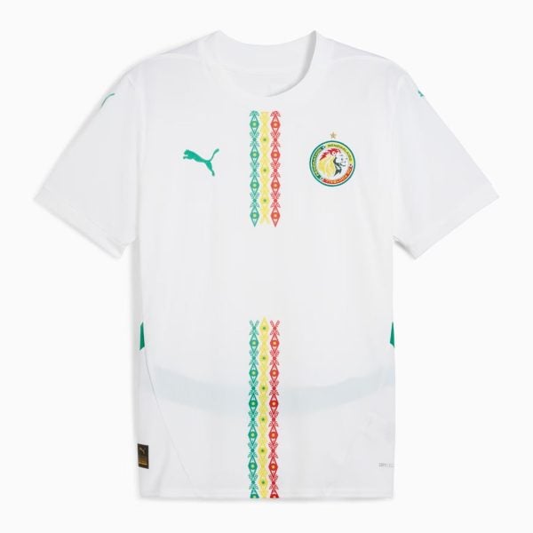 White soccer jersey with a green Puma logo on the left and the Senegal Football Federation crest on the right, centered by vertical multicolored diamond stripes.