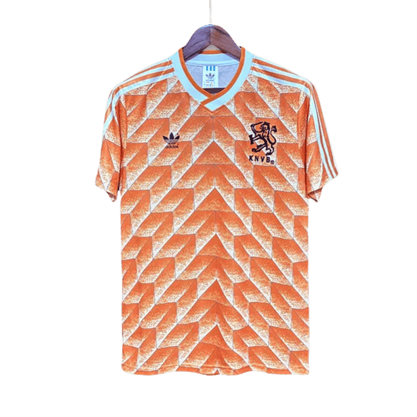 Orange Dutch national team football jersey with geometric pattern, Adidas logo, and KNVB crest on chest.