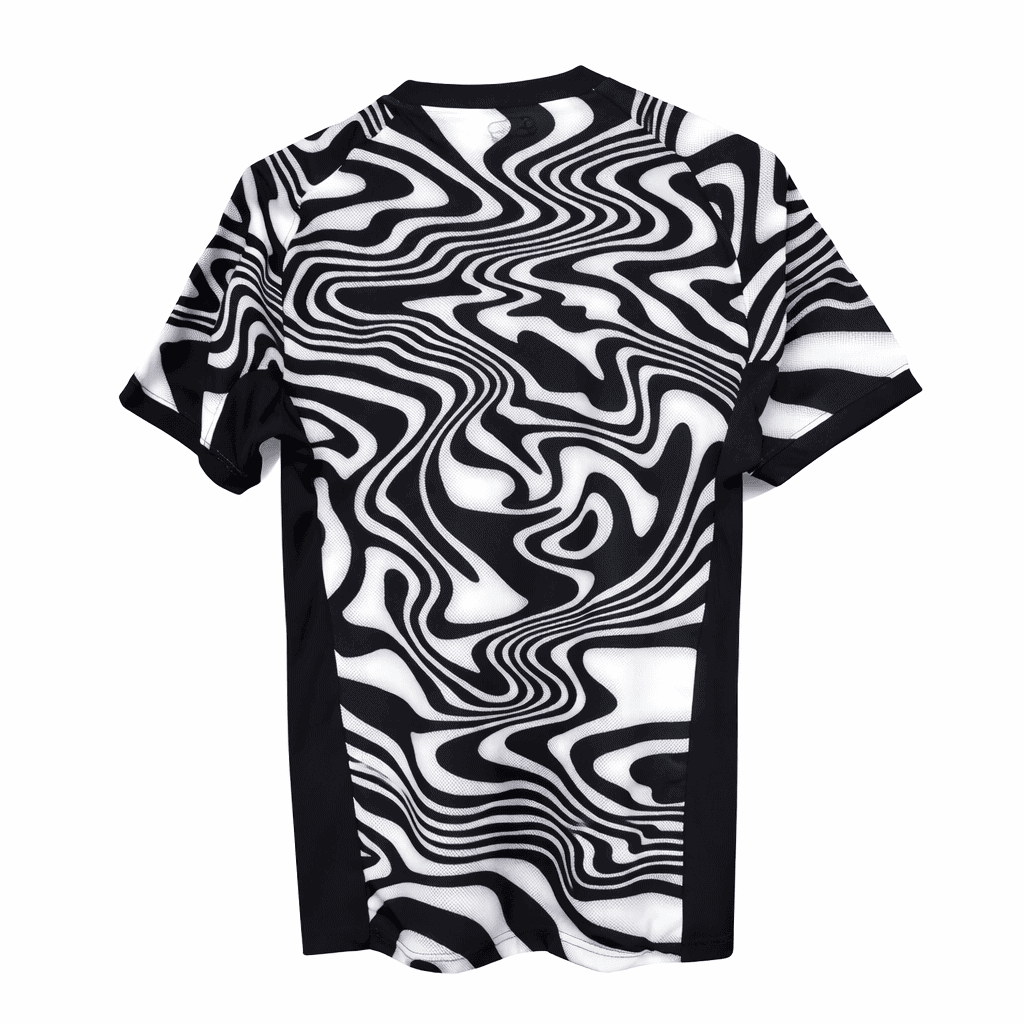 IMG-7432 | AE JERSEY Black-and-white short-sleeve t-shirt with bold swirling optical pattern.