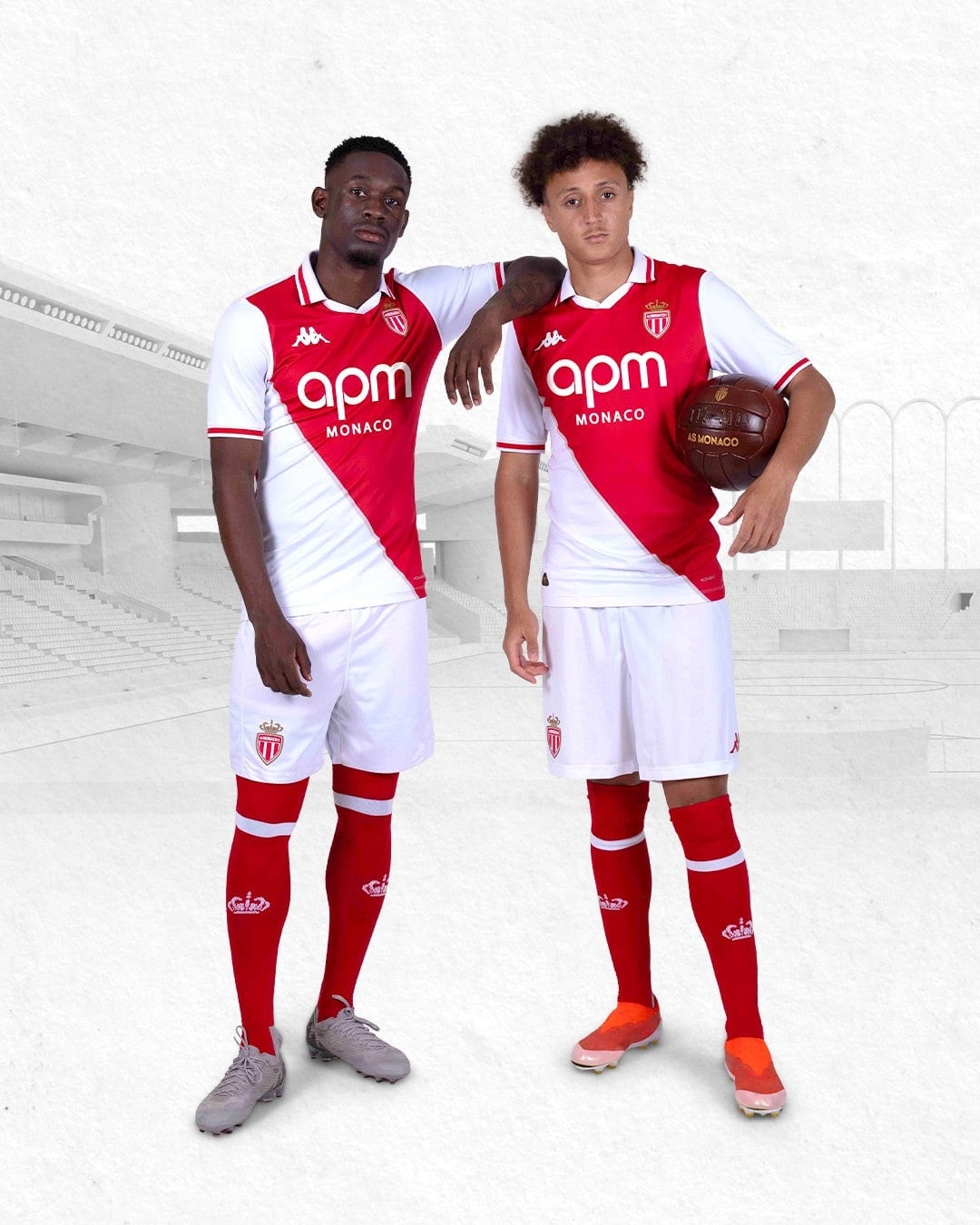 JUUDLLbZEsuNHu5 | AE JERSEY Two soccer players in red-and-white AS Monaco kits pose together on a pale background stadium.
