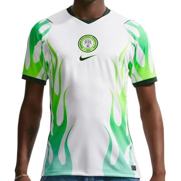 White Nigeria football jersey with green flame pattern and crest on chest, Nike logo in the center.