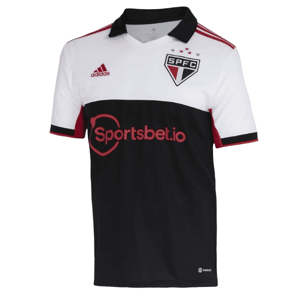 White and black São Paulo FC soccer jersey with red accents: crest on the left chest, Adidas logo on the right, red sponsor text 'Sportsbet.io' across the midsection, and red trim on the sleeves and collar.