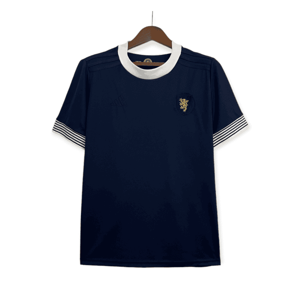 Navy blue dress on a hanger with a white rounded collar and striped white cuffs at the sleeves, front view with crest badge on the chest area.