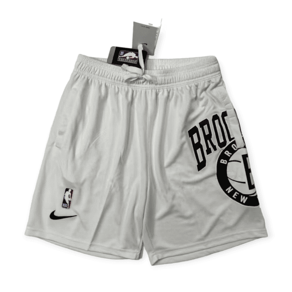 Gray athletic shorts with a white drawstring, featuring an NBA logo patch and a Nike swoosh visible near the hem.