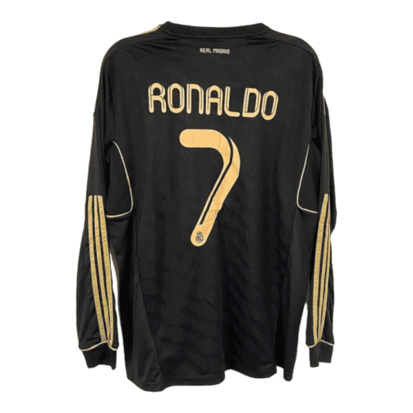 Back view of a black Real Madrid jersey with 'RONALDO' and the number 7 in gold on the back, gold trim on sleeves.
